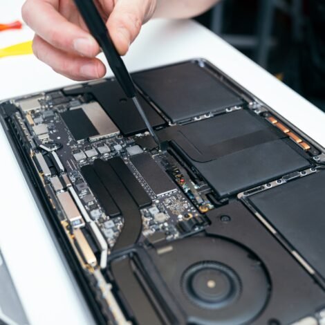 Harwich Specialists Solve Your Mac Problems Quickly And Easily 22 Unrecognizable Person Repairing Open Laptop's Internal Components