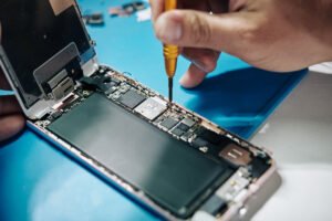 fixing a smartphone with a screwdriver 2026 01 08 00 10 03 utc